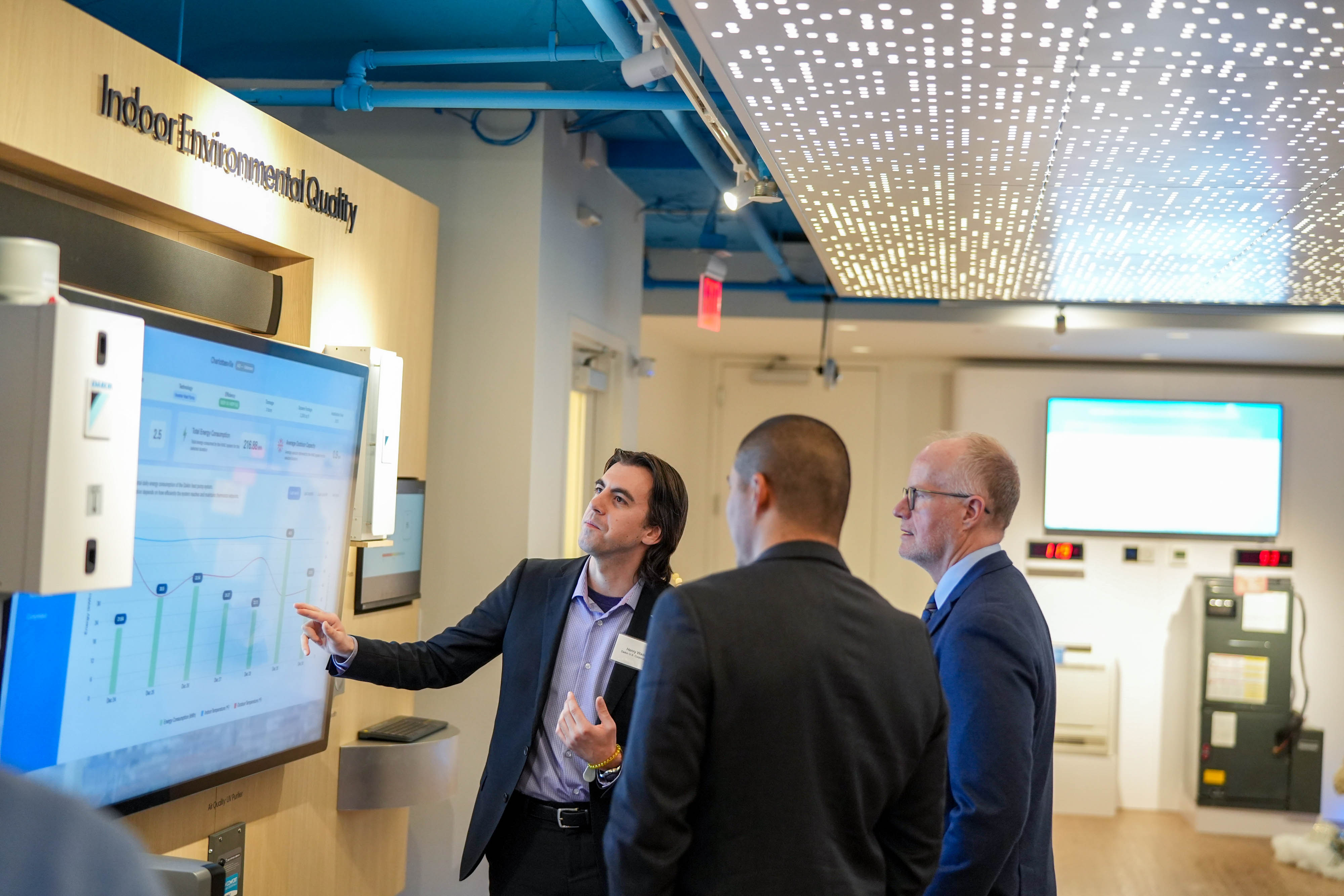 Attendees review indoor environmental quality data and system performance at Daikin’s DSIC Open House.